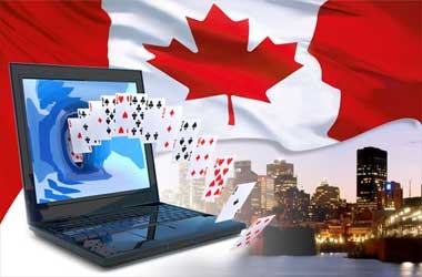 A deck of cards coming out of a laptop with the casino flag.